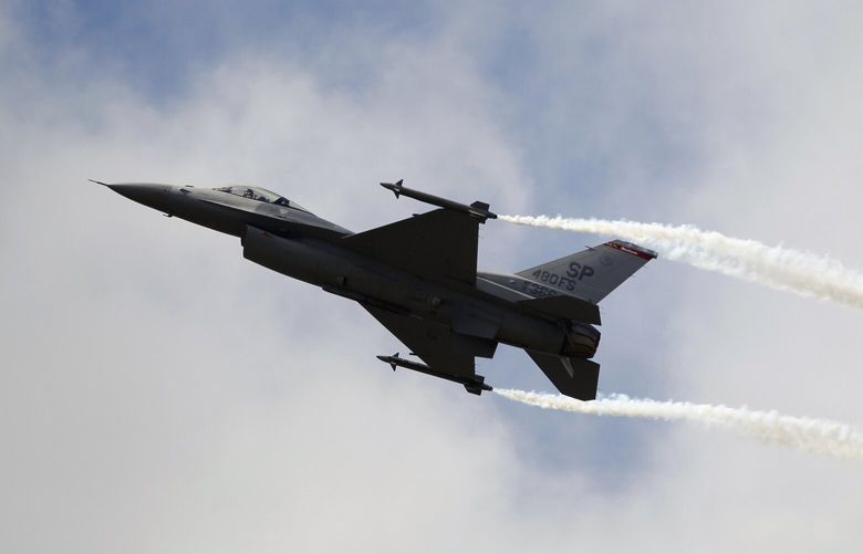 FILE – A Lockheed Martin F-16 Jet fighter performs its demonstration flight, June 22, 2011, at the 49th Paris Air Show at Le Bourget airport, east of Paris. People living in and around Washington D.C. experienced a rare, if startling, sound: A sonic boom. The U.S. military had dispatched a fighter jet on Sunday, June 4, 2023, to intercept an unresponsive business plane that was flying over restricted airspace. The Air Force gave the F-16 permission to fly faster than the speed of sound to catch up with it. (AP Photo/Francois Mori, File) NYSS101 NYSS101