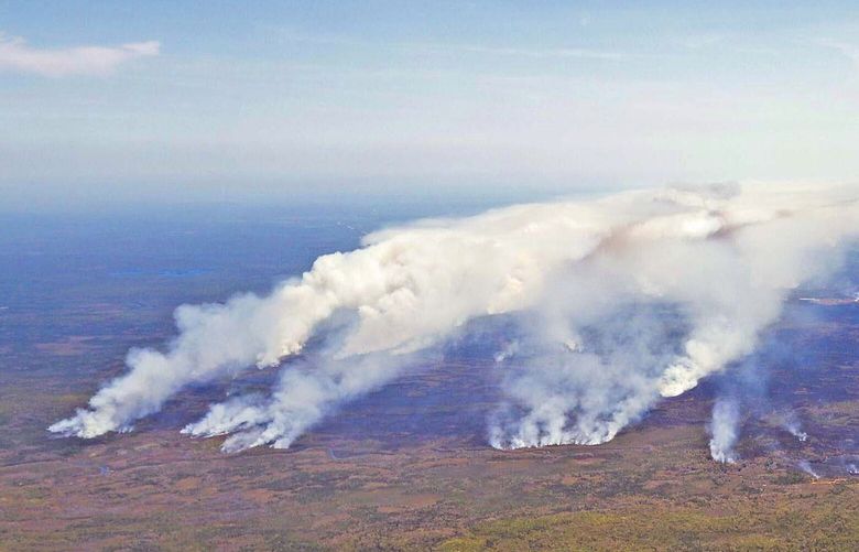 In this aerial image, wildfires burn in Shelburne County, Nova Scotia, on Wednesday, May 31, 2023. (Communications Nova Scotia/The Canadian Press via AP) HAL501 HAL501