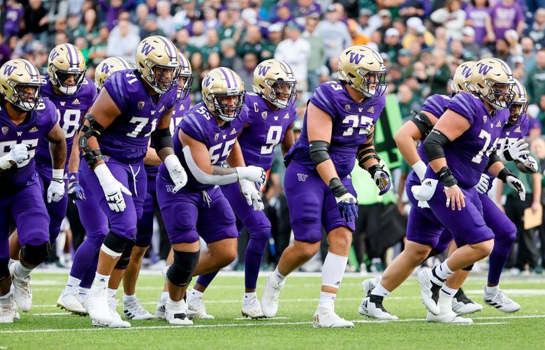 Husky linemen, from left, Henry Bainivalu (66), Nate Kalepo (71), Troy Fautanu (55), Roger Rosengarten (73) and Corey Luciano (74) rush to the line during the first quarter, Saturday, Sept. 17, 2022, in Seattle. 221586