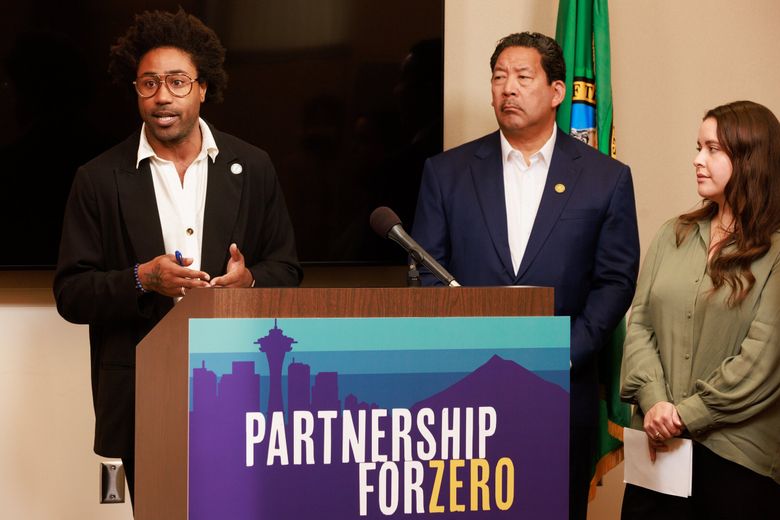 Marc Dones, left, CEO of the King County Regional Homelessness Authority, speaks during a news conference in Seattle in October. Next to him are Seattle mayor Bruce Harrell, center, and We Are In executive director Felicia Salcedo. (Erika Schultz / The Seattle Times, 2022)