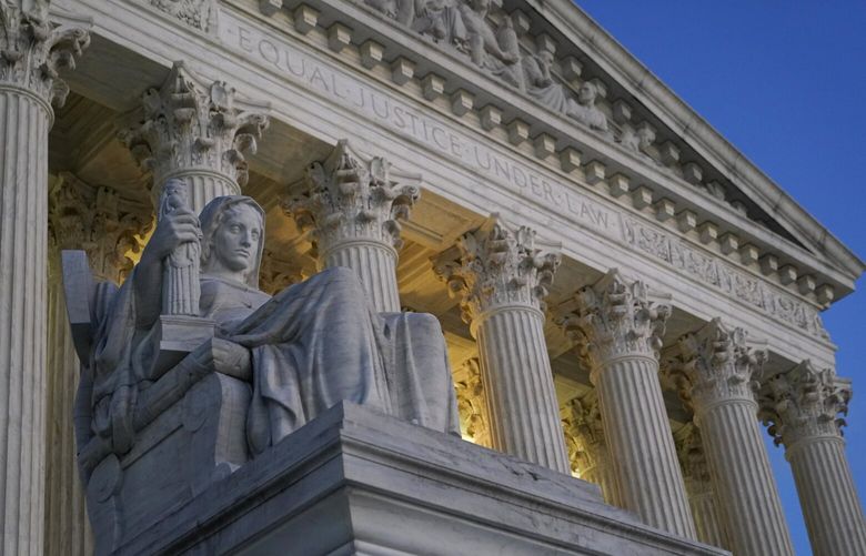 FILE- Light illuminates part of the Supreme Court building on Capitol Hill in Washington, Nov. 16, 2022.   (AP Photo/Patrick Semansky, File) 