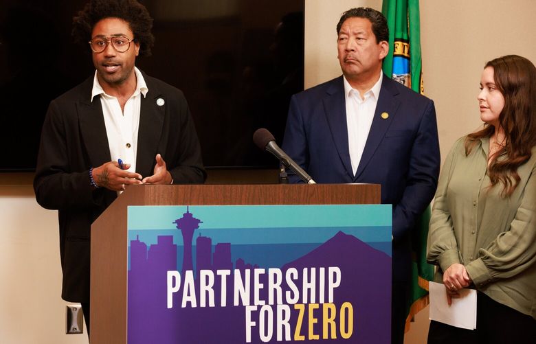 Marc Dones, CEO of the King County Regional Homelessness Authority, speaks during a press conference in Seattle Wednesday, Oct. 12, 2022. Seattle mayor Bruce Harrell is center and We Are In executive director Felicia Salcedo is right. 221807