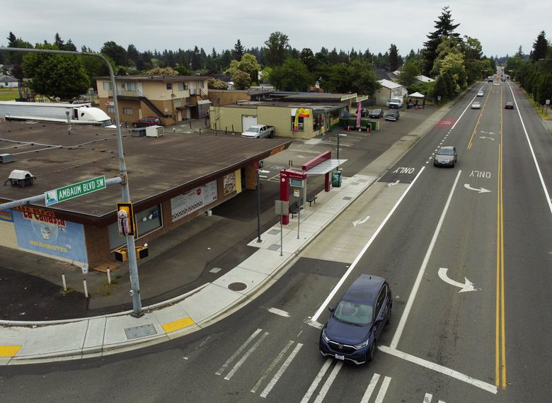 Looking south down Ambaum Boulevard Southwest at Southwest 136th Street in Burien last month. This corner is surrounded by nearby houses and apartments, as well as La Canasta market and an H Line RapidRide stop. (Ken Lambert / The Seattle Times)