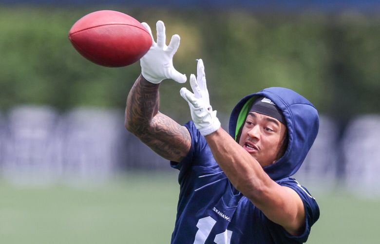 Seahawks Jaxon Smith-Njigba makes a reception Thursday morning during minicamp at Virginia Mason Athletic Center in Renton, Washington on June 8, 2023.