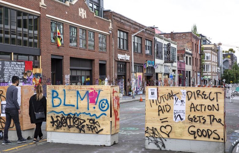 Looking south on 11th Avenue from East Pine Street at the CHOP, Capitol Hill Organized Protest, previously known as CHAZ, on a quiet Sunday morning, June 21, 2020. 214314