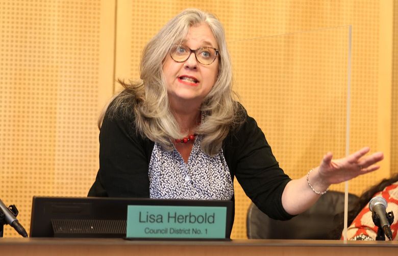 Councilmember Lisa Herbold tries to quell a crowd who wants to speak after the allotted time was up during a Seattle City Council meetinmg that will vote on an ordinance to give the city attorney prosecution power on public drug use and drug possession in Seattle on Tuesday, June 6, 2023.