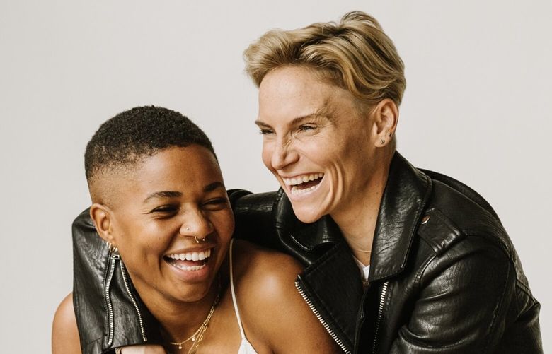 OL Reign teammates and activists Tziarra King, left, and Jess Fishlock publicly announced their engagement in October of 2022. Fishlock and King are vocal about their beliefs regarding attacks against gender identify and sexual orientation. “Visibility is one of the biggest things that we can do,” King said. Here they are posing for an engagement photograph.