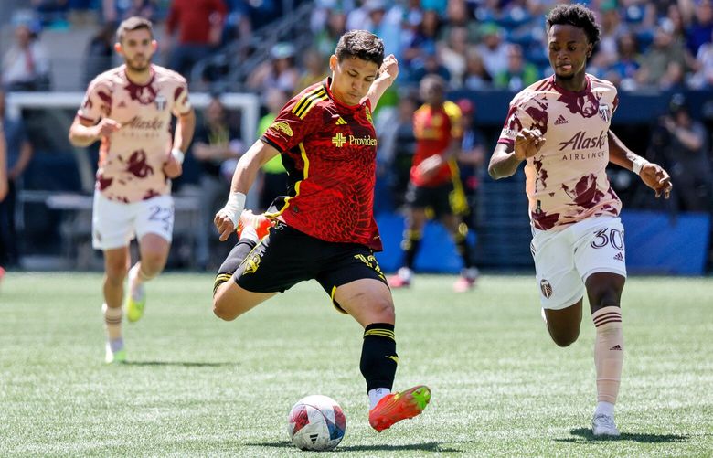 Seattle Sounders FC forward Fredy Montero lines up a shot against Portland Timbers midfielder Santiago Moreno during the first half. 224067