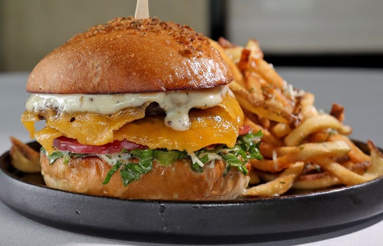 The Canlis salad burger, with Parmigiano Reggiano Truffle fries.
Photographed at Canlis restaurant, 2576 Aurora Ave N, Seattle. 224133