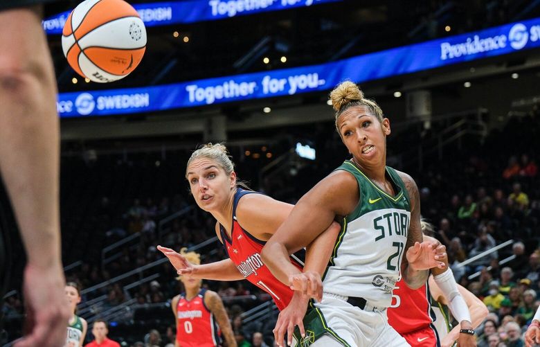 Seattle’s Mercedes Russell, right and Washington’s Elena Delle Donne do battle in the low post in the second quarter. 224110
