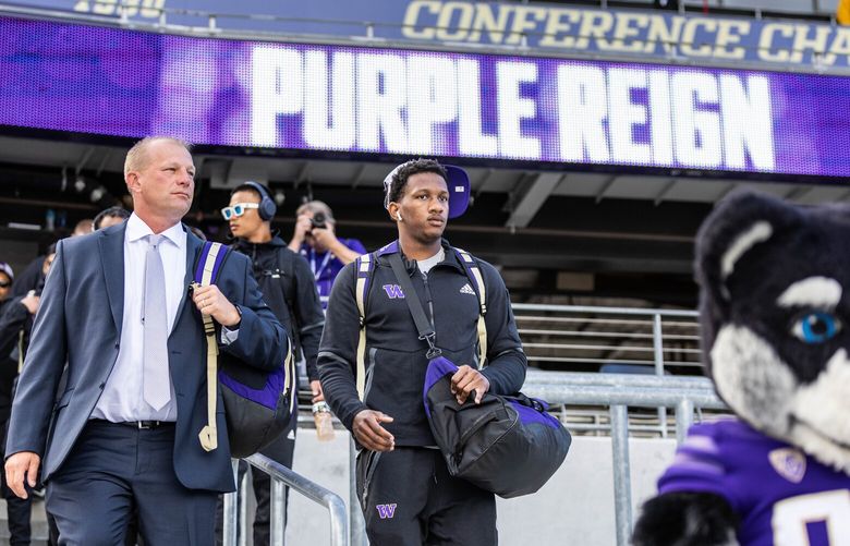 Harry Husky leads Washington coach Kalen DeBoer, and quarterback Michael Penix Jr., into Husky Stadium for Saturday’s season openere with Kent State. 221472