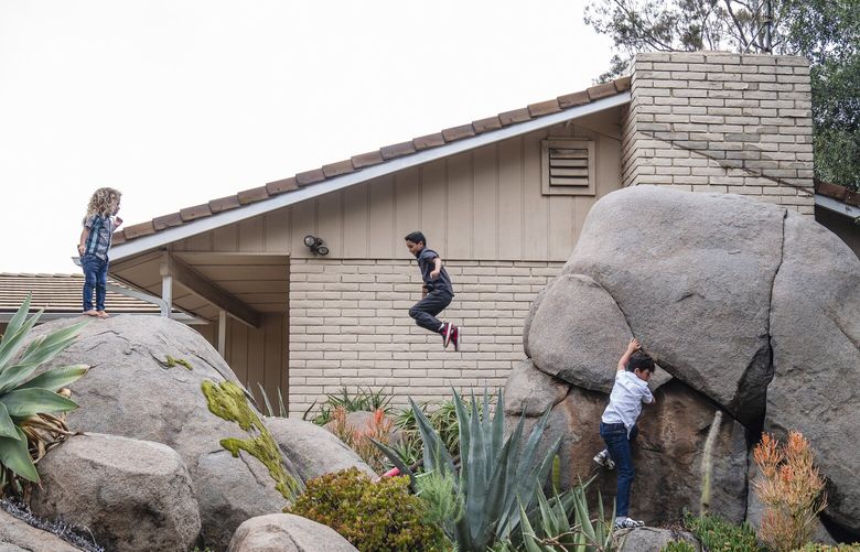 Emily Ziegler’s children playing at home in Alpine, Calif., on June 11. The family’s home insurance policy with USAA doubled to $8,000 last year, and when  Ziegler called other insurers in search of a better deal, they all gave her the same advice: Hold on tightly to your existing policy. (Ariana Drehsler / The New York Times) 