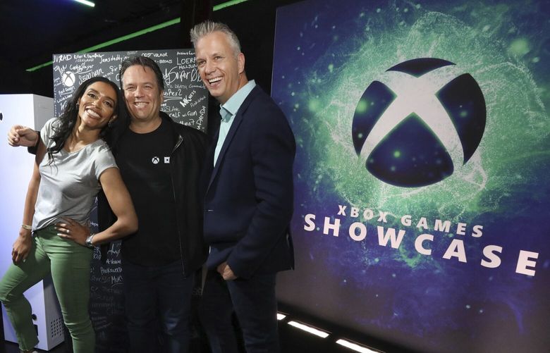 IMAGE DISTRIBUTED FOR XBOX – Sarah Bond, from left, CVP Game Creator Ecosystem, Phil Spencer, Head of Xbox, and Matt Booty, CVP Xbox Game Studios, pose during the 2023 Xbox FanFest on Sunday, June 11, 2023 in Los Angeles. (Casey Rodgers/AP Images for Xbox) CPALA503 CPALA503