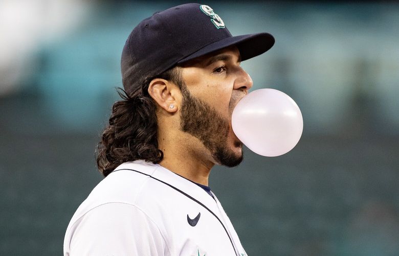 Mariners third baseman Eugenio Suárez, 28, blows a bubble Wednesday, June 14, 2023, as the Seattle Mariners take on the Miami Marlins at T-Mobile Park in Seattle.