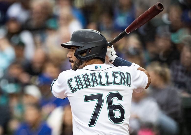 Seattle Mariners' Jose Caballero (76) and Julio Rodriguez (44