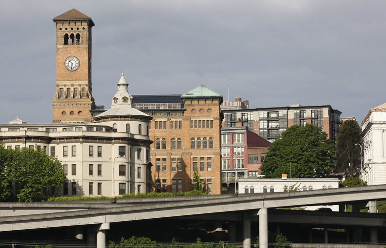 Historic buildings in downtown Tacoma, Wash., including the clock tower of the city’s old city hall, are shown Wednesday, May 19, 2010, in Seattle. (AP Photo/Ted S. Warren) NYEOTK