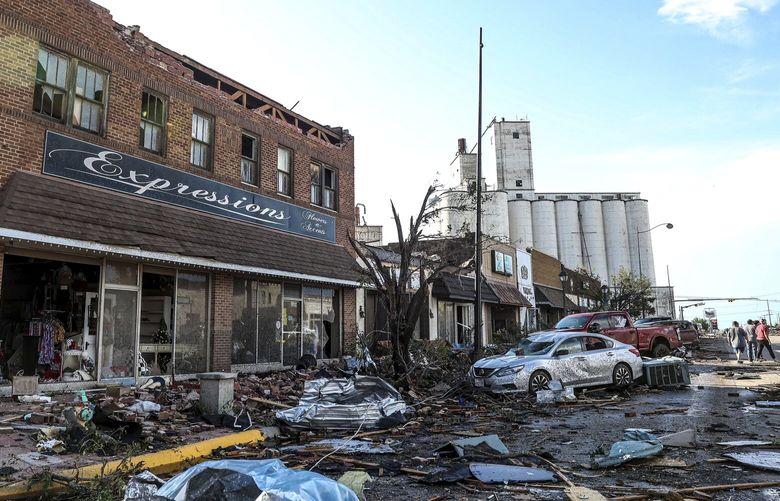 Buildings and vehicles show damage after a tornado struck Perryton, Texas, Thursday, June 15, 2023. (AP Photo/David Erickson) TXDE102 TXDE102