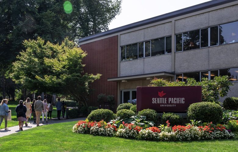 Seattle Pacific University faculty and staff walk out during Interim President Pete Menjares’ state of the union address during the university’s Opening Communion on Thursday, Sept. 1, 2022. The walk out was in protest of the Christian university’s policy against hiring or promoting people in same-sex relationships. 221446
