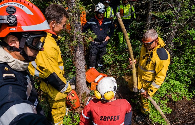 A team with Quebec’s forest fire control agency train a contingent of firefighters from France at a base in Roberval, Quebec, Canada on June 11, 2023. The first foreign firefighters to reach Quebec amid Canada’s worst wildfire season on record said that some fires were 100 times bigger than any they had ever seen. (Renaud Philippe/The New York Times) XNYT0773 XNYT0773