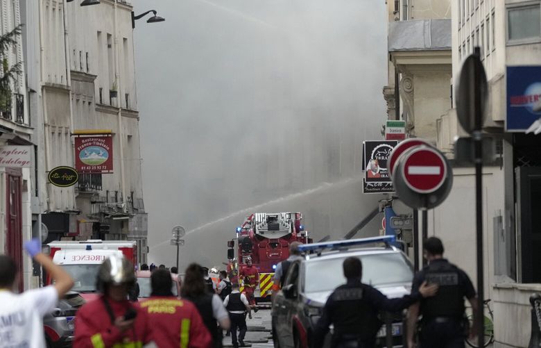 Firemen use a water canon as they fight a blaze Wednesday, June 21, 2023 in Paris. Firefighters fought a blaze on Paris’ Left Bank that is sent smoke soaring over the domed Pantheon monument and prompted evacuation of buildings in the neighborhood, police said. Local media cited witnesses describing a large explosion preceding the fire, and saying that part of a building collapsed. (AP Photo/Christophe Ena) PAR128 PAR128