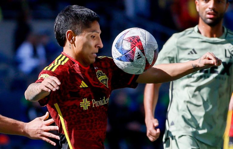 Seattle Sounders FC forward Raul Ruidiaz eyes the ball during the second half. 223317