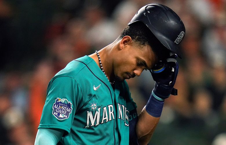 Seattle Mariners’ Julio Rodriguez heads to the dugout after striking out with the bases loaded to end the top of the second inning of a baseball game against the Baltimore Orioles, Friday, June 23, 2023, in Baltimore. (AP Photo/Julio Cortez) BAB115 BAB115