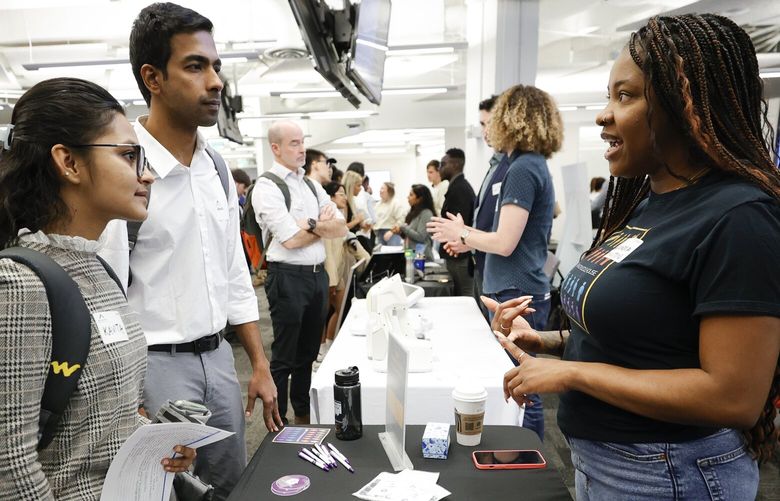 Georgia State University students Kavita Javalagi, left, and Gana Natarajan, second from left, speak with Shetundra Pinkston, during the Startup Student Connection job fair, Wednesday, March 29, 2023, in Atlanta. For the thousands of workers who’d never experienced upheaval in the tech sector, the recent mass layoffs at companies like Google, Microsoft, Amazon and Meta came as a shock. Now they are being courted by long-established employers whose names aren’t typically synonymous with tech work, including hotel chains, retailers, investment firms, railroad companies and even the Internal Revenue Service. (AP Photo/Alex Sliz) NYPM201 NYPM201