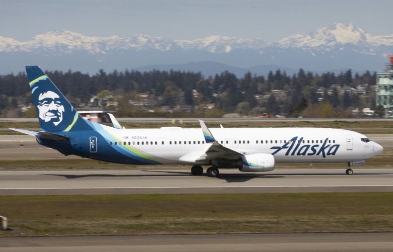 An Alaska Airlines jet takes off at Seattle-Tacoma International Airport in SeaTac Thursday, April 7, 2022.  Expansion plans at Alaska Airlines have been hit by the reality of staff shortages and travel chaos. 220071