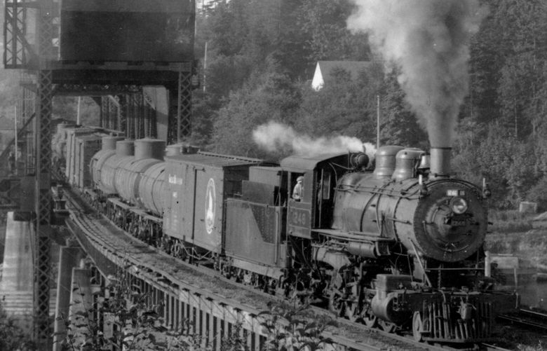 THEN: Locomotive 1246 rolls south across the Ballard railroad bridge circa 1940. (James Turner / Great Northern Railway Historical Society)