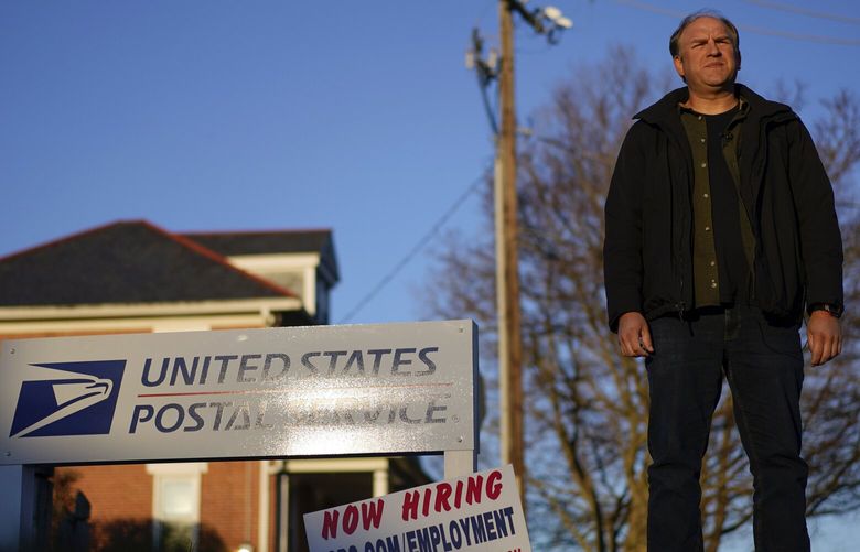 FILE – Gerald Groff, a former postal worker whose case will be argued before the Supreme Court, stands during a television interview near a “Now Hiring” sign posted at the roadside at the United State Postal Service, March 8, 2023, in Quarryville, Pa. The Supreme Court on Thursday, June 29, used the case of a Christian mailman who didn’t want to work Sundays to solidify protections for workers who are religious. In a unanimous decision the justices made clear that workers who ask for religious accommodations, such as taking the Sabbath off, should get them unless their employers show doing so would result in “substantial increased costs” to the business. (AP Photo/Carolyn Kaster, File) WX213 WX213