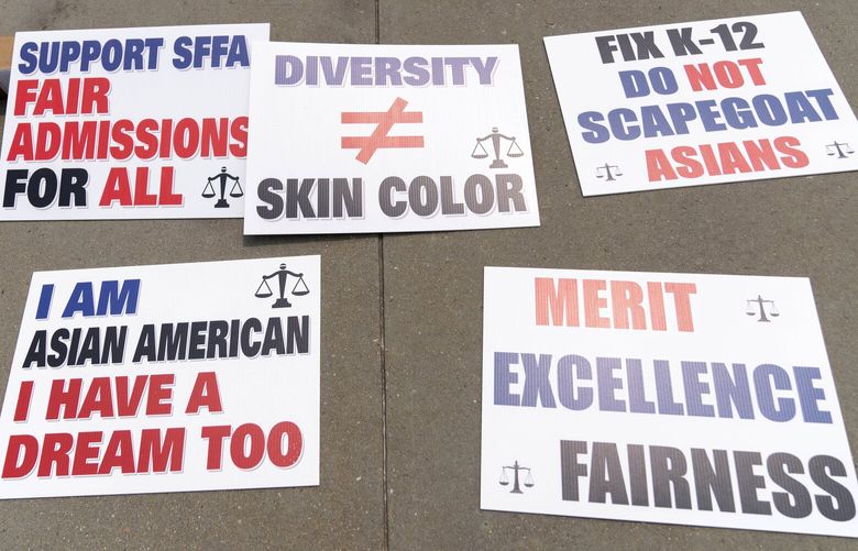 Signs from the Asian American Coalition for Education as seen outside of the Supreme Court following the ruling on affirmative action on Thursday, June 29, 2023, in Washington. (AP Photo/Jose Luis Magana) DCJL107 DCJL107