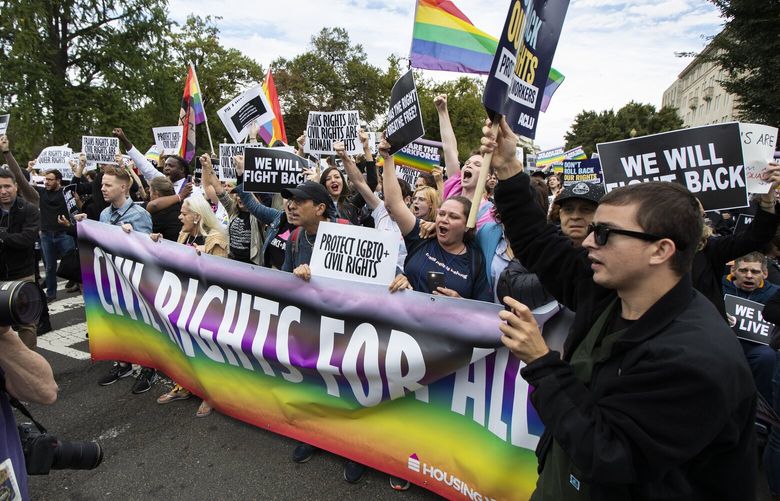 FILE – Supporters of LGBTQ rights stage a protest on the street in front of the U.S. Supreme Court on Oct. 8, 2019, in Washington. Louisiana Democratic Gov. John Bel Edwards blocked a package of anti-LGBTQ+ legislation from becoming law Friday, June 30, 2023, including the state’s version of a “Don’t Say Gay” bill and a ban on gender-affirming medical care for transgender youths. (AP Photo/Manuel Balce Ceneta, File) NYAB516 NYAB516