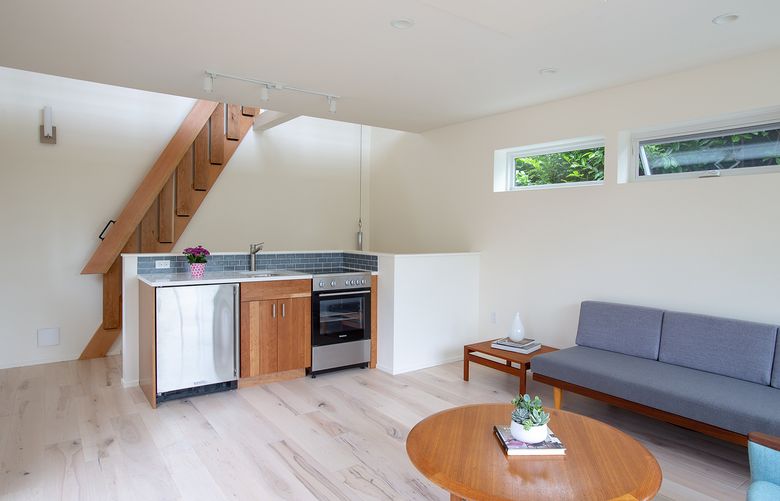 This DADU in the Ravenna neighborhood near Green Lake features a custom-built folding staircase that leads to a loft. (Courtesy of Brian Hartman)