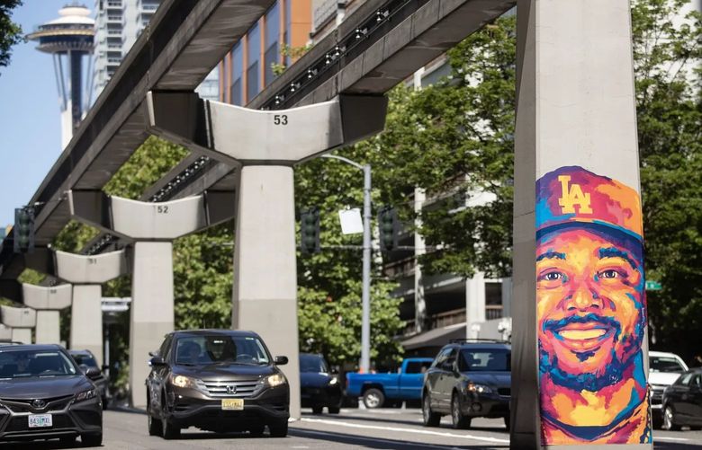 A mural of Los Angeles Dodgers outfielder Mookie Betts is one of eight murals of MLB players and eight murals of local fans recently installed in downtown Seattle ahead of the 2023 MLB All-Star Game. (Luke Johnson / The Seattle Times)
