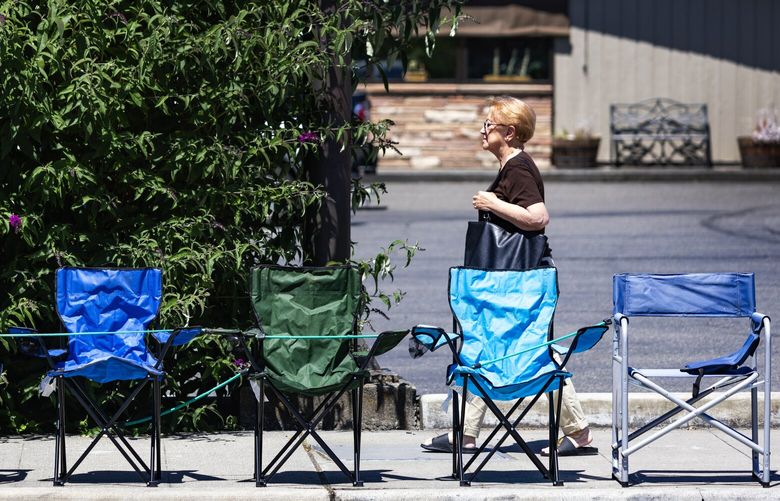 Bothell does not procrastinate when it comes to the Fourth of July, with multitudes of chairs already allowed along the city’s parade route, seen here on Main Street, Sunday, July 2, 2023. City signs up stating “advance chair placement begins July 1” helped start things going.