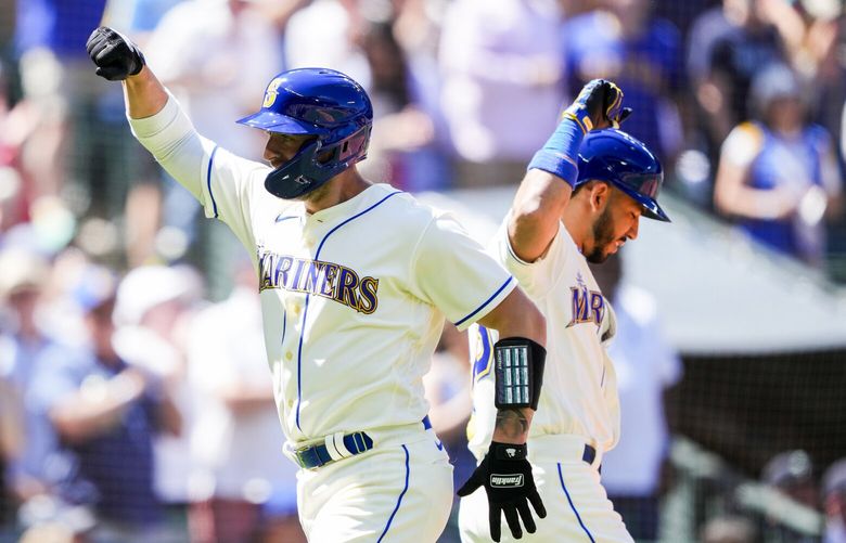 Seattle Mariners’ Tom Murphy celebrates his home run with teammate Jose Caballero, right, during the sixth inning of a baseball game against the Tampa Bay Rays, Sunday, July 2, 2023, in Seattle. (AP Photo/Lindsey Wasson) WALW131 WALW131