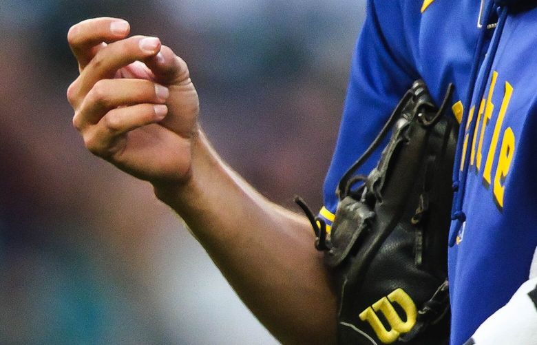 An unknown injury to Bryce Miller’s throwing hand forced him from the game in the fourth. 224267