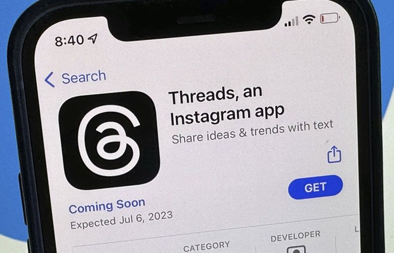 The announcement of the social media app ‘Threads’ is displayed in Apple’s US App Store seen on the screen of a smartphone in Berlin, Germany, Tuesday, July 4, 2023. Meta is poised to launch a new app that appears to mimic Twitter in a direct challenge to the social media platform owned by billionaire Elon Musk. A listing for the app, called Threads, appeared on Apple’s App Store, indicating it would debut as early as Thursday. (Christoph Dernbach/dpa via AP) DSOB107 DSOB107