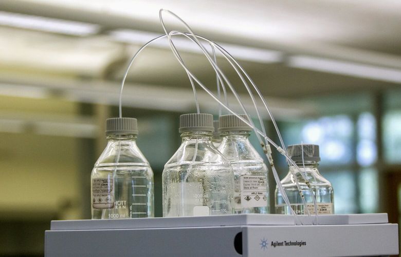 FILE – Equipment used to test for perfluoroalkyl and polyfluoroalkyl substances, known collectively as PFAS, in drinking water is seen at Trident Laboratories in Holland, Mich., June 18, 2018. Drinking water from nearly half of U.S. faucets likely contains “forever chemicals” linked to kidney cancer and other health problems, according to a government study released Wednesday, July 5, 2023. (Cory Morse/The Grand Rapids Press via AP, File) MIGRA301 MIGRA301