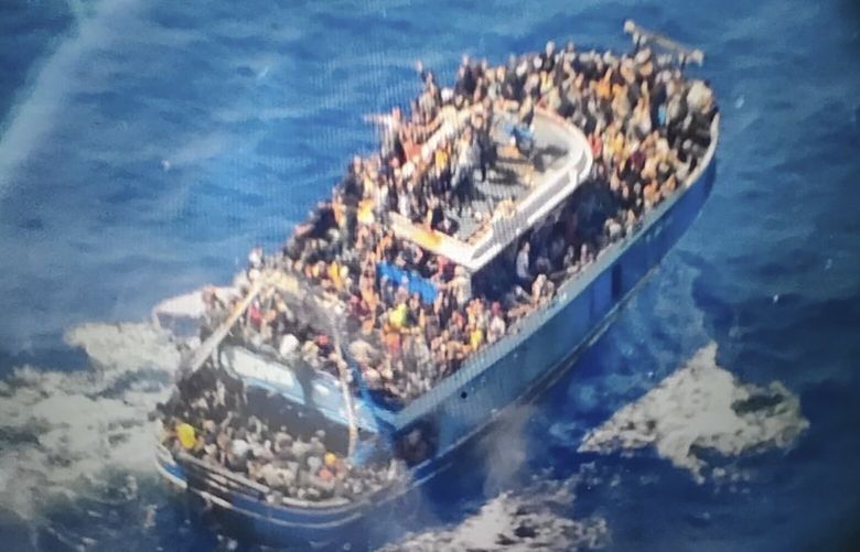 FILE – This undated handout image provided by Greece’s coast guard on Wednesday, June 14, 2023, shows scores of people on a battered fishing boat that later capsized and sank off southern Greece. The saga of a lost submersible that had gone into the depths of the ocean to see the Titanic wreckage rippled across the national and global conversation. But a far bigger disaster days earlier, the wrecking of the ship with migrants, didn’t become a moment-by-moment worldwide focus in anywhere near the same way.(Hellenic Coast Guard via AP, File) XKS404 XKS404