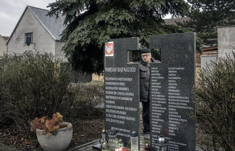 Ryszard Marcinkowski, a son of a survivor of the massacre in Volhynia, and leader of the Borderlands Association, at a monument commemorating lives lost in 1943 in Swiatniki, Poland, Feb. 18, 2023. Memories of ethnic pogroms by Ukrainian nationalists in the 1940s complicate Poland’s welcome to ukrainian refugees. (Maciek Nabrdalik/The New York Times)