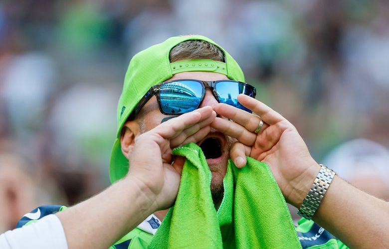 Broncos Russell Wilson greets some Seahawks, 1st fans in boo