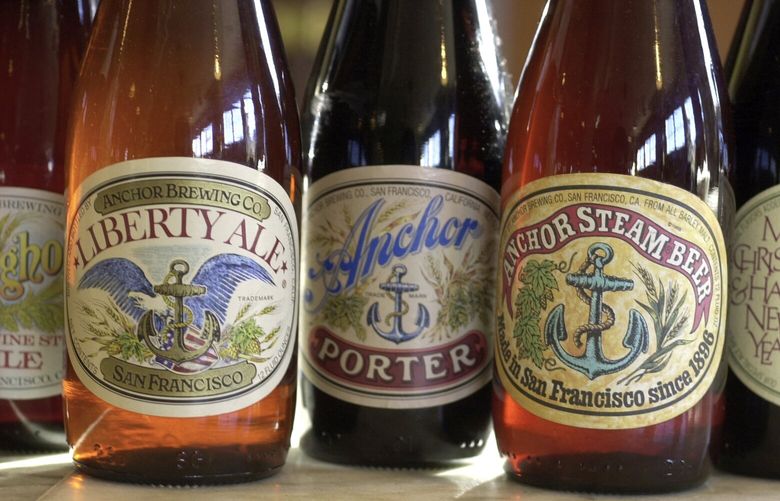 FILE – In this 2004 file photo, a number of artisan beers made at Anchor Brewing Co. are dsiplayed in San Francisco. Anchor Brewing Co. says it is halting its operations and liquidating the business, citing declining sales and challenging economic conditions. The San Francisco-based brewer said Wednesday, July 12, 2023, that it gave employees 60-day notice and plans to provide transition support and separation packages. (Craig Lee/San Francisco Chronicle via AP, File) CAFRA501 CAFRA501