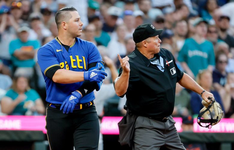 Home plate umpire Marvin Hudson ejects Ty France from the ball game during the fifth inning. 224406
