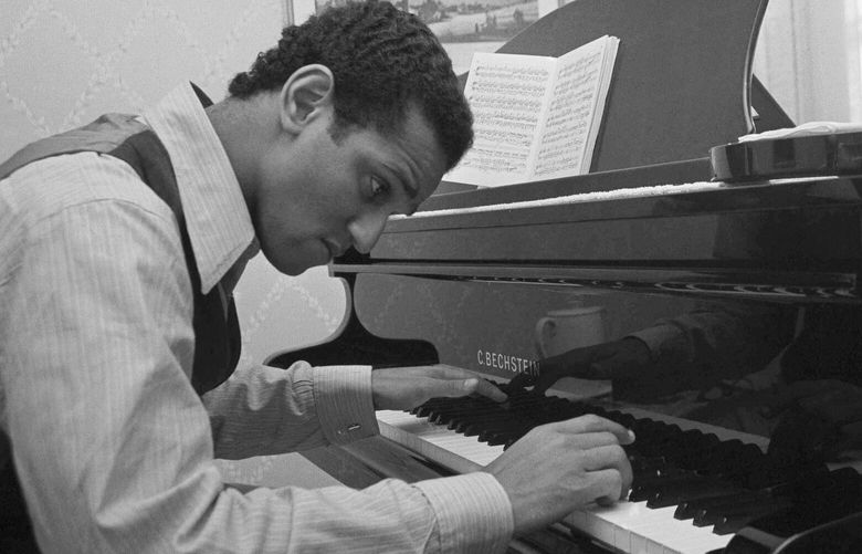 FILE – Andre Watts, 16, performs the Liszt piano concerto No. 1 with the New York Philharmonic, on Jan. 31, 1963. Watts died Wednesday, July 12, 2023 in Bloomington, Ind., at age 77. (AP Photo/Matty Zimmerman, File) NYET514 NYET514