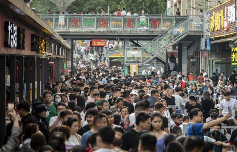 Crowds fill the tables for barbecue in Zibo, China, on May 2, 2023. Chinese consumers have remained wary of spending after their finances suffered because of the government’s strict “zero Covid” policies. (Qilai Shen/The New York Times) 