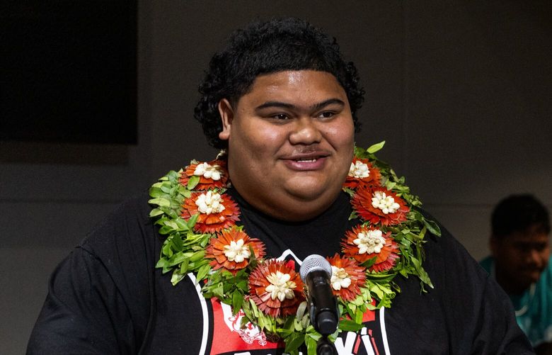 As his family looks on, Iam Tongi, left, who went to Federal Way’s Decatur High School, speaks to the King County Council chamber after the council recognized the American Idol winner (Season 21), Tuesday, July 18, 2023 in Seattle, for “becoming the first person from Hawaii, the first Pacific Islander and the first Washington resident to win the competition…” Tongi, 18, is also the first winner to have been born after the show’s premiere in 2002.