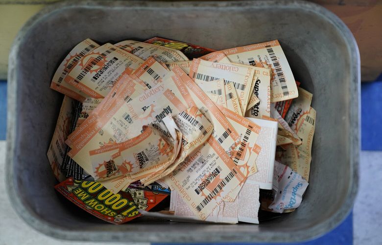 Powerball ticket receipts are seen in the garbage, Wednesday, July 19, 2023, in Hawthorne, Calif. With lottery jackpots for Powerball and Mega Millions cumulatively approaching $2 billion for this week’s drawings, millions of people across the country will be lining up at convenience store, grocery and gas station counters hoping to hit it big. (AP Photo/Ryan Sun) CARS120 CARS120