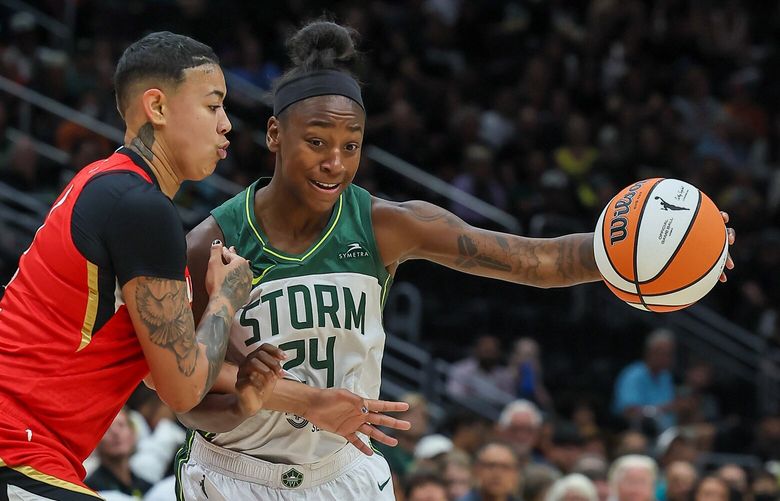 Seattle Storm guard Jewell Loyd is jammed up and fouled by Las Vegas Aces guard Kierstan Bell Thursday evening at Climate Pledge Arena in Seattle, Washington on July 20, 2023. The Storm are down 39-39 to the Aces at the half.