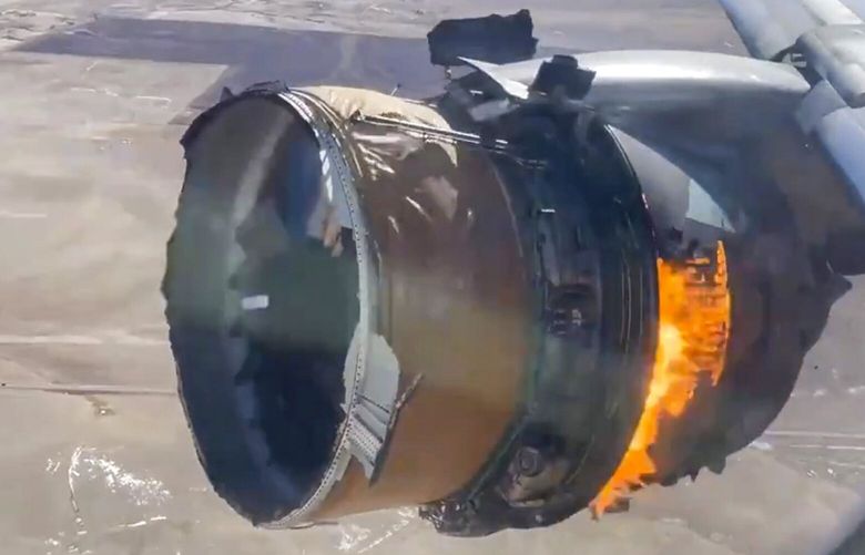 In this image taken from video, the engine of United Airlines Flight 328 is on fire after after experiencing “a right-engine failure” shortly after takeoff from Denver International Airport, Saturday, Feb. 20, 2021, in Denver, Colo. The Boeing 777 landed safely and none of the passengers or crew onboard were hurt. (Chad Schnell via AP) NYDD201